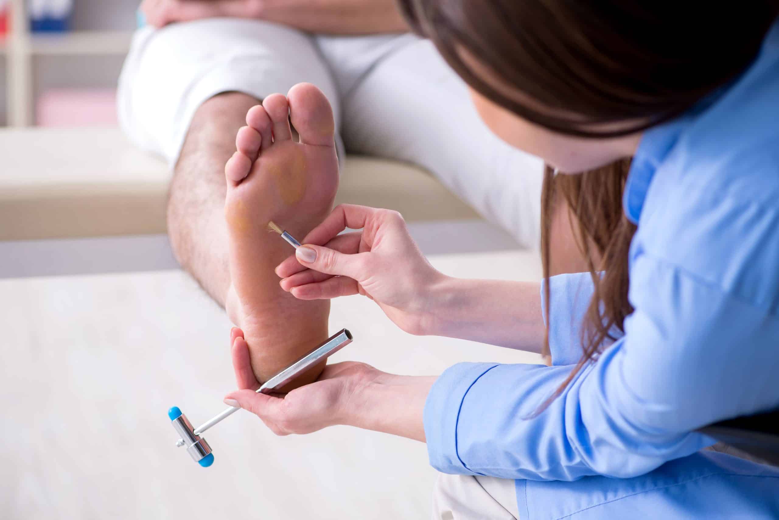 doctor diagnosing patient with neuropathy