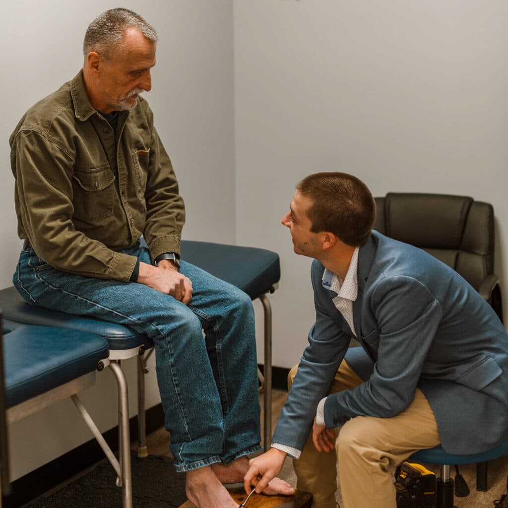 Chiropractor in Eau Claire at Advantage Health Center examining a patient.