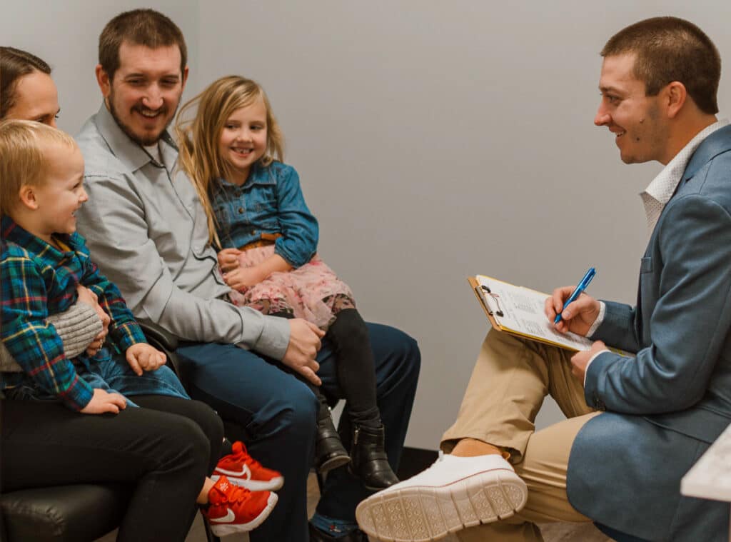 Chiropractic care consultation with a family at Advantage Health Center in Eau Claire.