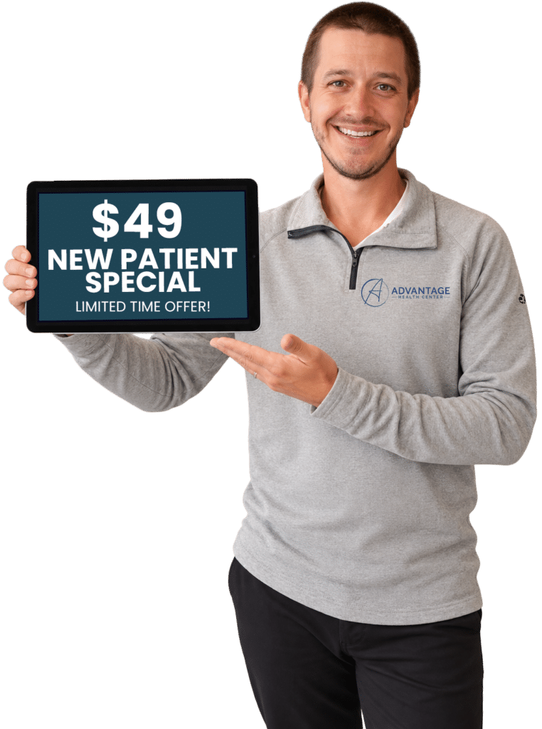 Dr. Zach holding up a new patient special coupon.